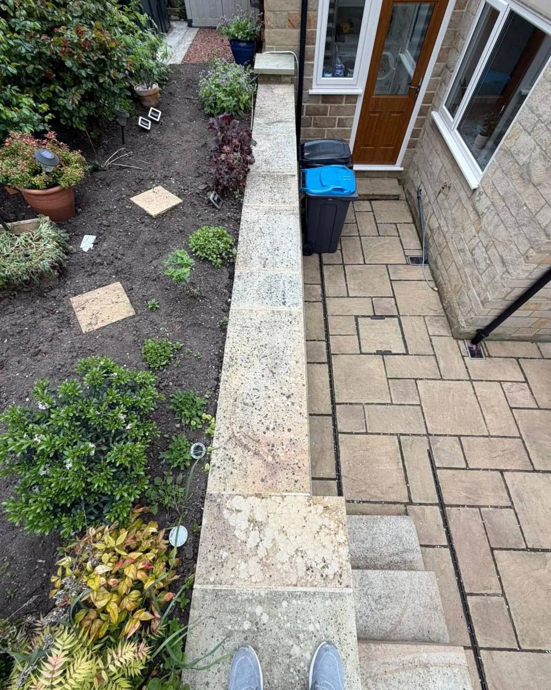 Side passage path clean before cleaning by Hopkins Exterior Cleaning