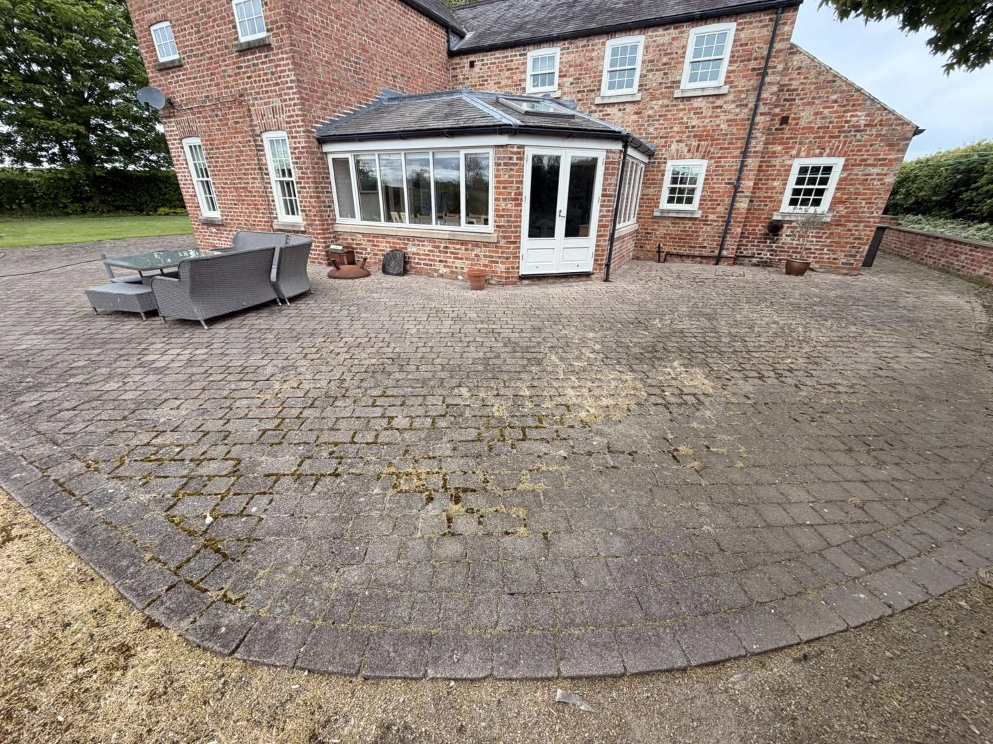Large rear patio clean before cleaning by Hopkins Exterior Cleaning